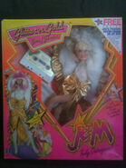 Glitter 'n Gold Jem doll with hair bow, cape, body suit, skirt, tights, bracelets, shoes, microphone, Suede skirt, sunglasses, sandals and cassette tape from Hasbro.