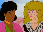 Pizzazz ordering Georgia to create a disguise for Clash.