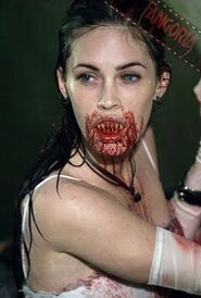 Jennifer, in her Succubus form, covered in blood,having bitten Chip in the neck.