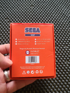 Numskull coin packaging back.