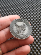 Numskull coin 'side b'.