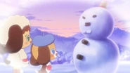 The girl Jewelpet and young Yuku building a snowman.