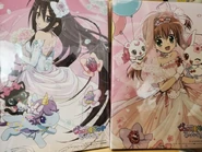 Merchandises of the wedding attire design artworks for Akari and Alma. (Source)