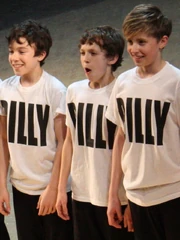Holland (centre) performing at the fifth anniversary of , 31 March 2010