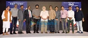 A photo of R. Madhavan and others posing for the camera.