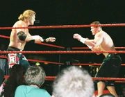 Cena facing off against  at a WWE  in July 2006