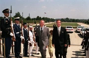 Secretary of Defense  escorts Spielberg through a military honor cordon into the Pentagon in 1999.