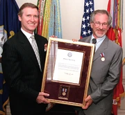 Spielberg receiving a public service award presented by U.S