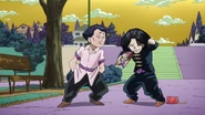 Tamami being yelled at by Hazamada for ruining his manga.
