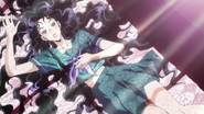 Yukako lying seductively on a bed.