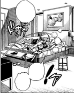 Jobin and Mitsuba play around on the bed