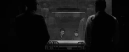 A young Winston and  in an interrogation room