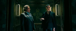 Winston and  inside the hotel's elevator,