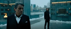 Winston grieving while John approaches.