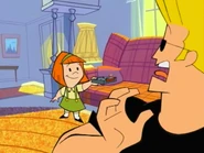 Suzy holding Johnny's remote.