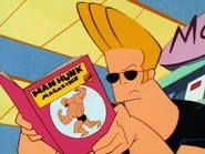 Johnny looking through Man Hunk Magazine.