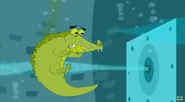 The alligator struggles against being sucked into the machine