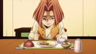 Hayato llorando sentado a la mesa después de la muerte de Kira, aguantando las ganas de llorar por su madre.