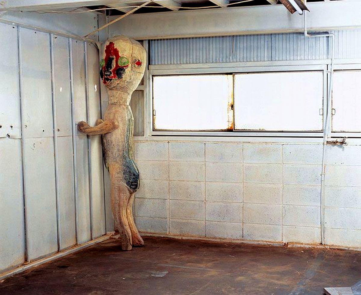 What is SCP-173's true form, and how did it get trapped in a