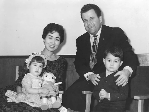 With her parents and brother