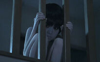 Toshio stares at Karen.