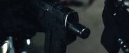 A close up shot of the Lawgiver in "Silencer Mode."