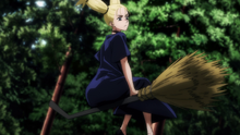 Momo riding her broom above Nobara (Anime)