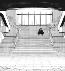 Yuji sits alone on stairs in Shibuya