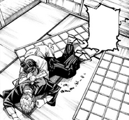 Naoya is stabbed in the back and suffers a pathetic demise.