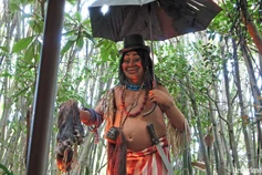 Chief Nah-mee with his canopy skirt and shrunken-heads