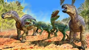 A Neovenator chases the herd of iguanadons.