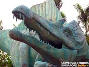 Spinosaurus, the same statue on the left