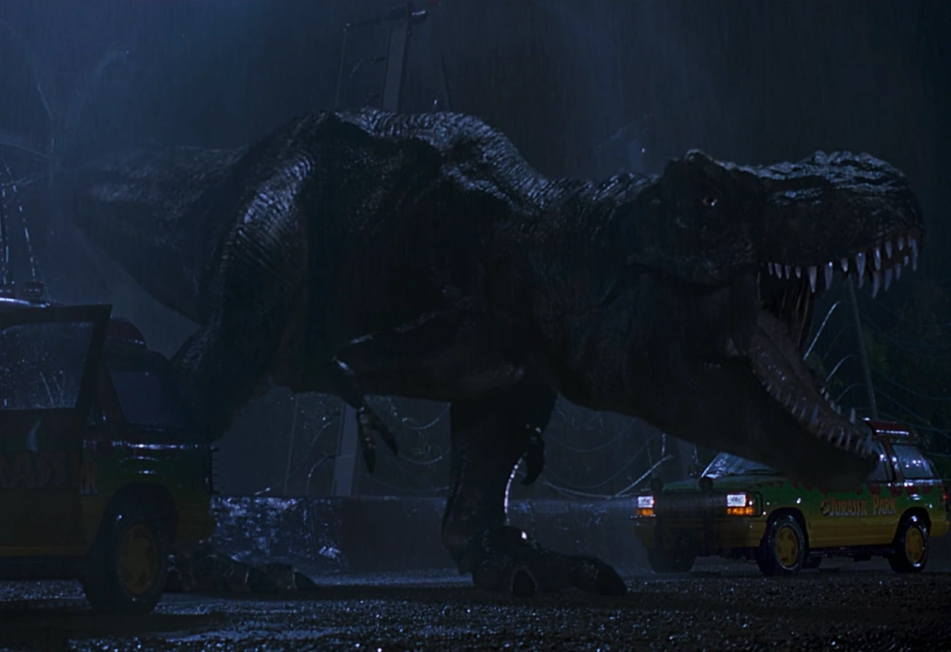 Fullbody screenshot of "Rexy" from Jurassic Park (1993); she seems trim compared to scientific models from circa the 2020s