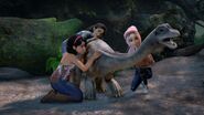 The camper girls: Brooklynn, Yaz and Sammy comforting the baby Brachiosaurus