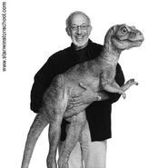 Stan Winston holding the Junior maquette.