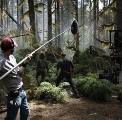 Owen and Zia(?) in the forest JW- Dominion BTS.jpeg