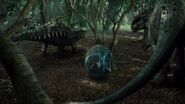 Indominus rex and Ankylosaurus about to fight with Gyrosphere 07 in the center