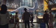 Apatosaurus hologram in front of Gray, Zach, and Zara.