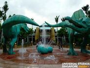 Food Court, with statues of the T. rex and the Spinosaurus