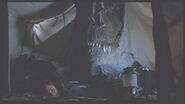 Sarah hides below the Tyrannosaur