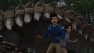 Kenji and Yasmina going through the Ankylosaurus