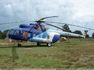 Another image of an MI-8, with a vibrant design of blue and white.