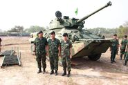 Soldiers standing in front of a BTR-3E with a CSE-90LP turret.