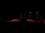 Freddy Fazbear looking at the stuffed player during the Game Over screen.