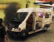 Heavily damaged with missing components. It's very unusual for a real van to have a rear compartment side door on the left side.