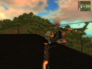 JC1 bad Guerrila AI.jpg (139 KB) Here is a rare example of the Guerrilla AI in a bad moment. The pilot somehow flew the chopper into the building without blowing up, and then "flipped" up right into this position. Seconds after this picture was taken, the pilot flew the chopper into a smokestack.