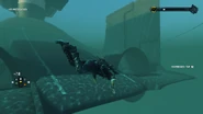 Rear end of the submarine, under water.