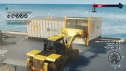 Using a Wheel Loader to dump containers into the sea.