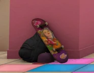 Sara on a skateboard in the background of Hollaback Girl