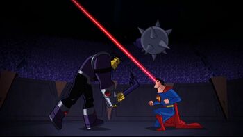 In the arena, Superman breaks Mongul's mace.